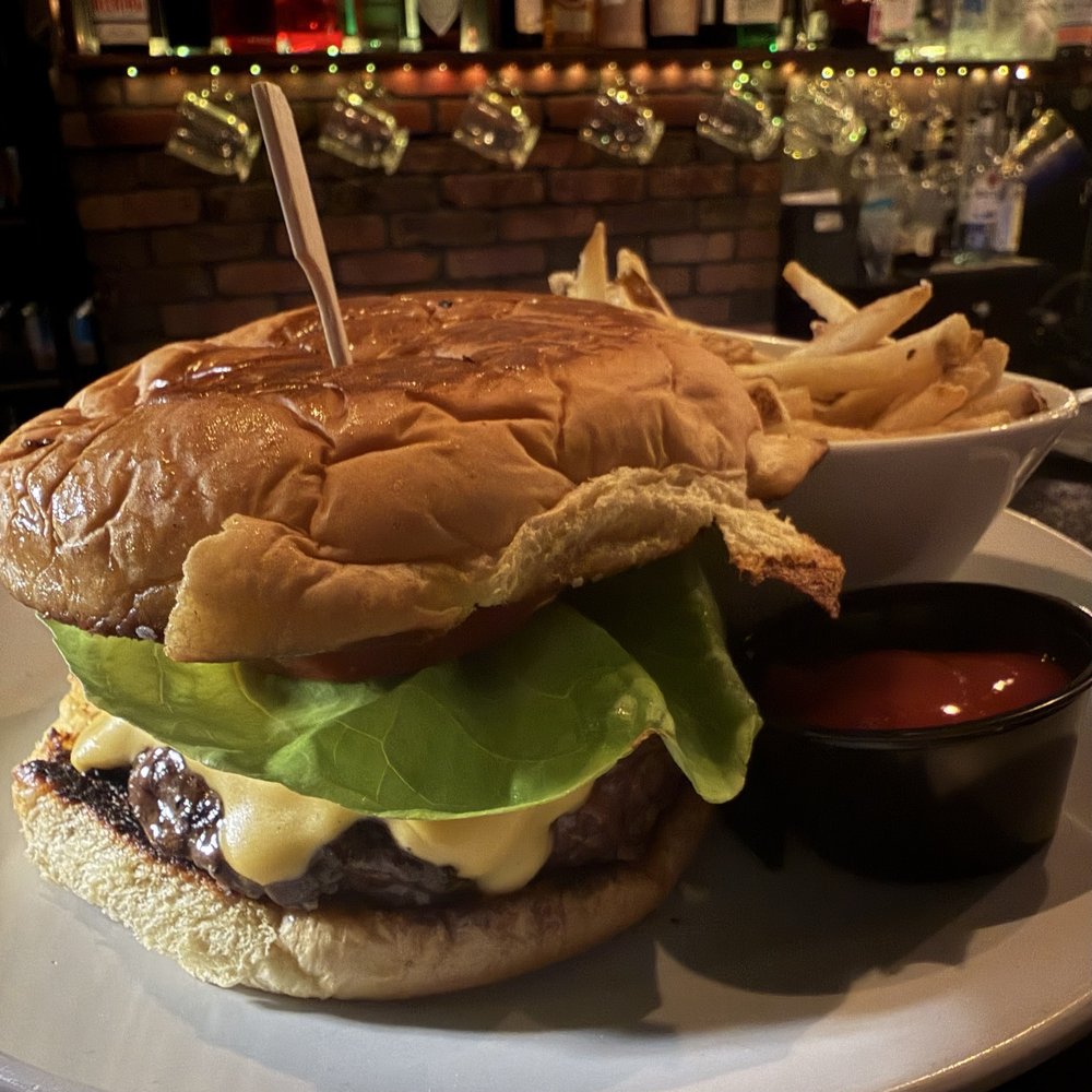 Cody's Restaurant - 8oz PRIME ANGUS BURGER w/butter lettuce, tomato, red onion, american cheese, truffled mayo on a martin's potato roll. - New American Near Me - New Braunfels, Texas Cody's Restaurant - 8oz PRIME ANGUS BURGER w/butter lettuce, tomato, red onion, american cheese, truffled mayo on a martin's potato roll. - New American Near Me - New Braunfels, Texas