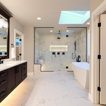 Spaces General Contracting - Premium bathroom remodel. Espresso vanity cabinets, sleek matte black fixtures, and breathtaking marble tile throughout. - General Contractors Near Me - Seattle, Washington Spaces General Contracting - Premium bathroom remodel. Espresso vanity cabinets, sleek matte black fixtures, and breathtaking marble tile throughout. - General Contractors Near Me - Seattle, Washington
