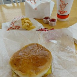 Burger Boy [single patty burger with mustard, lettuce, tomatoes and onions on a grilled bun], reg. fries, and reg. drink)