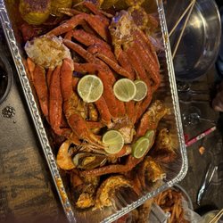 Juicy Seafood - Family seafood combo plate! Lobster tail, crab legs, shrimp, crawfish, muscles, corn and potato.