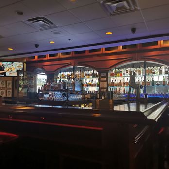 Frashers Tavern - a bar with a row of bar stools - Steakhouses Near Me - Scottsdale, Arizona