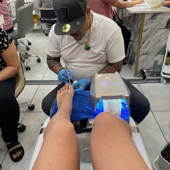IPolish Nail Bar - Tommy getting down on some toes! - Nail Salons Near Me - Phoenix, Arizona
