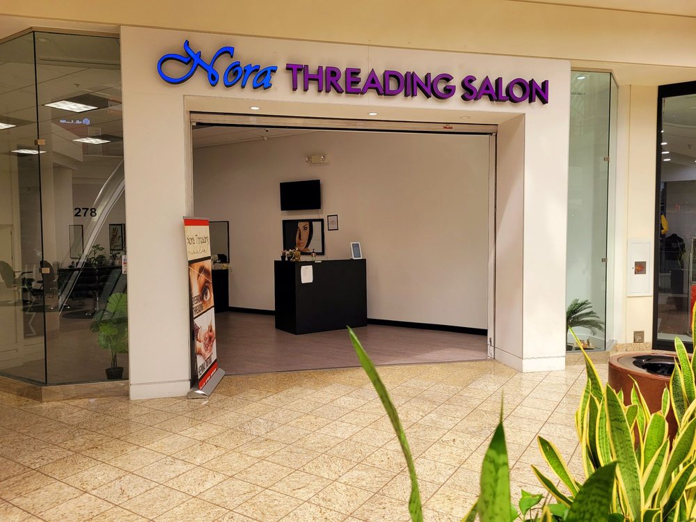 Nora Threading Salon Logo