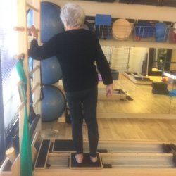 Lift Total Wellness - This 88 year old is doing a side plank on the CoreAlign which strengthens our lateral Fascial system