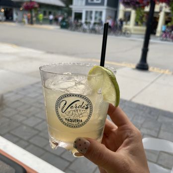 Verdes - a hand holding a glass of margarita - Salad Near Me - Mackinac Island, Michigan