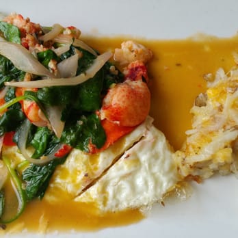 Batter & Berries - Lobster with spinach egg white omelet atop with garlic sauce - Breakfast & Brunch Near Me - Chicago, Illinois Batter & Berries - Lobster with spinach egg white omelet atop with garlic sauce - Breakfast & Brunch Near Me - Chicago, Illinois