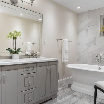 Elite Cabinetry - a bathroom with a large mirror - Cabinetry Near Me - La Quinta, California