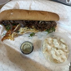 Fire Pit Brazilian Barbeque - Beef brisket sub with a side of potato salad