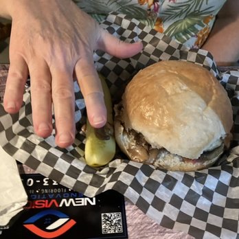 Terry's Place - Mushroom Swiss Burger and a pretty good size pickle. My hand to show size of burger. - American Near Me - Ocala, Florida