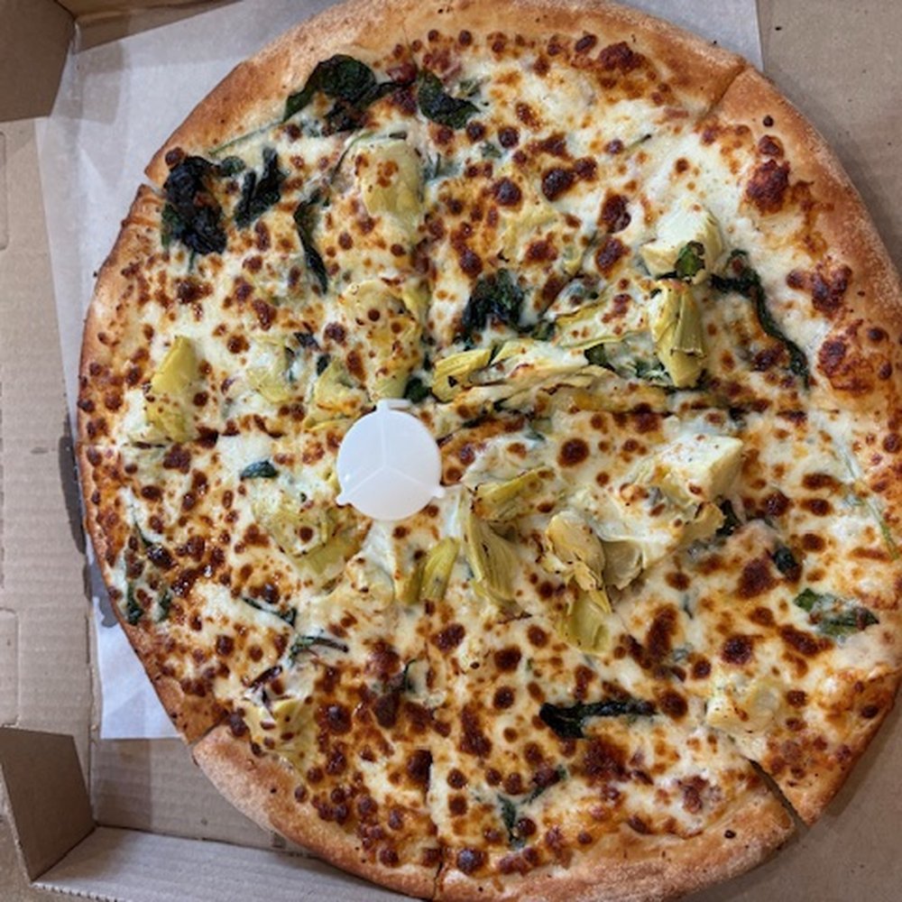 Johnny's Pizza - Chicken bacon artichoke. Most artichoke in the center 1/2. Crust is a tad thicker than what I would consider "thin". - Pizza Near Me - Meridian, Idaho Johnny's Pizza - Chicken bacon artichoke. Most artichoke in the center 1/2. Crust is a tad thicker than what I would consider "thin". - Pizza Near Me - Meridian, Idaho