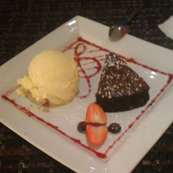 271 West - Flourless chocolate cake with walnuts baked in, with a great helping of french vanilla ice cream. - Italian Near Me - Kitchener, Ontario