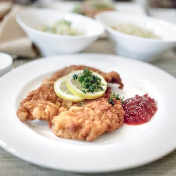 Naschmarkt - Campbell - Classic Wiener Schnitzel $32 "with ligonberry sauce, Austrian potato salad, lemon and crispy parsley" - Austrian Near Me - Campbell, California Naschmarkt - Campbell - Classic Wiener Schnitzel $32 "with ligonberry sauce, Austrian potato salad, lemon and crispy parsley" - Austrian Near Me - Campbell, California