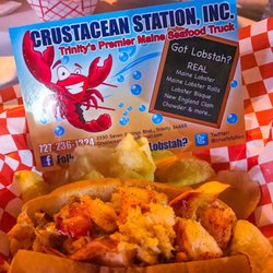 Crustacean Station - Warm lobster roll with butter and served with cape cod potato chips