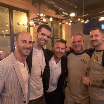 Meeting House Tavern - a group of men posing for a picture - Gay Bars Near Me - Chicago, Illinois