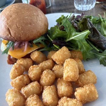 Neptune's - The breakfast sandwich with tater tots and salad - New American Near Me - Alameda, California
