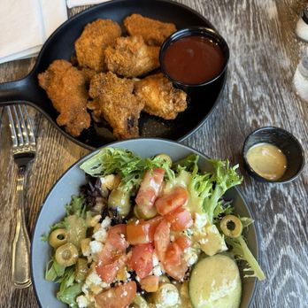 Wolfey's Bistro & Pub - Cajun wings with signature BBQ on the side and Greek salad no onion. - New American Near Me - Elyria, Ohio
