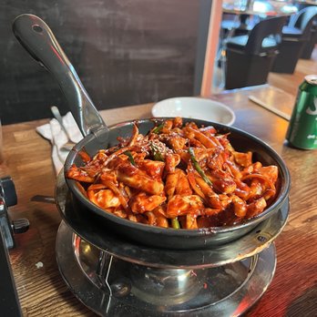 Hanshin Pocha - Stir fried squid in spicy sauce. This is medium spicy. Most can handle this level - Korean Near Me - Oakland, California Hanshin Pocha - Stir fried squid in spicy sauce. This is medium spicy. Most can handle this level - Korean Near Me - Oakland, California