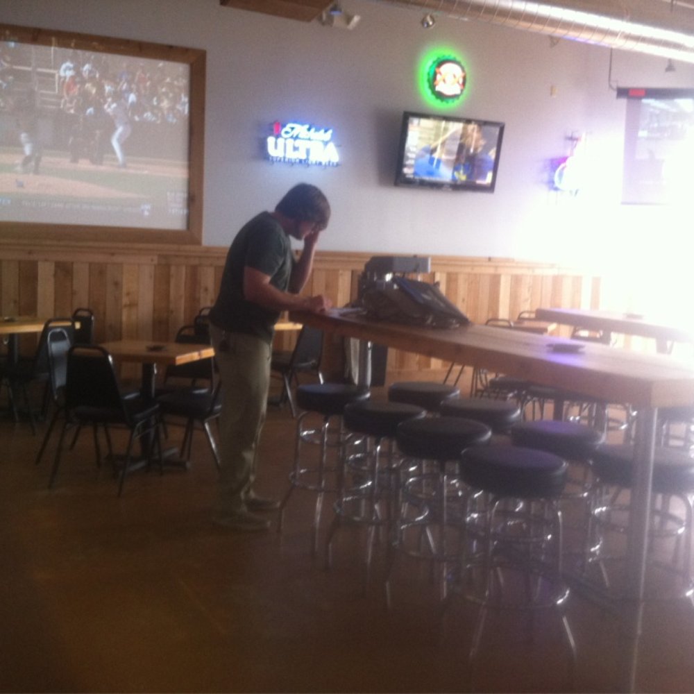 Cody Ray's Saloon - a man at a bar - Sports Bars Near Me - Pflugerville, Texas Cody Ray's Saloon - a man at a bar - Sports Bars Near Me - Pflugerville, Texas