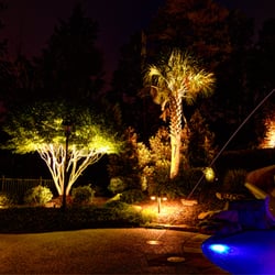 Fine Edge Landscape Design - Low voltage landscape lighting in Waxhaw, NC.Several spotlights and pathlights illuminate the entire pool area.