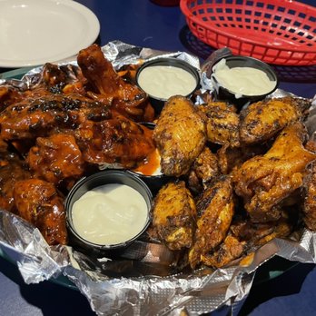Elmo's - Double dipped hot/BBQ on the left, Cajun on the right. - American Near Me - Getzville, New York Elmo's - Double dipped hot/BBQ on the left, Cajun on the right. - American Near Me - Getzville, New York