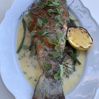 Isabelle Restaurant & Lounge - a fish dish with a lemon wedge - Canadian (New) Near Me - Burlington, Ontario