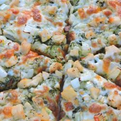 Pomegranate Grillhouse & Cafe - Chicken Pesto Pizza with homemade pesto and in-house grilled chicken!