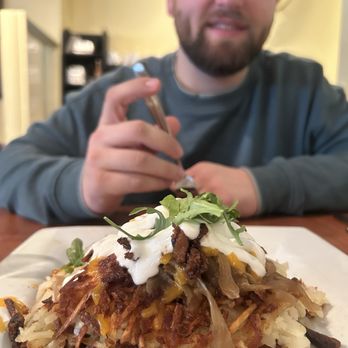Blue's Egg + Bakery - Daily Browns: Wisconsin with bacon, caramelized onion, cheese, arugula, and sour cream - Breakfast & Brunch Near Me - Milwaukee, Wisconsin
