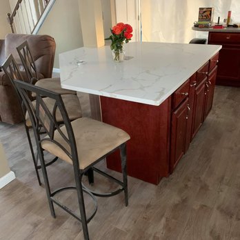 VOSS Renovation and Construction - a kitchen island with a marble countertop - General Contractors Near Me - Amherst, New York