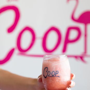 The Coop - a person holding a drink - Italian Near Me - Summerville, South Carolina The Coop - a person holding a drink - Italian Near Me - Summerville, South Carolina