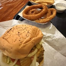 Jalapeño cheddar cheeseburger with everything on it, onion rings, and fries. Jalapeño cheddar cheeseburger with everything on it, onion rings, and fries.