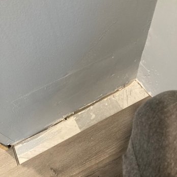 Diamond Flooring - Laminate floor isn't level and wasn't cap correctly. The new sheet rock wall that's not even smooth - Flooring Near Me - Boston, Massachusetts
