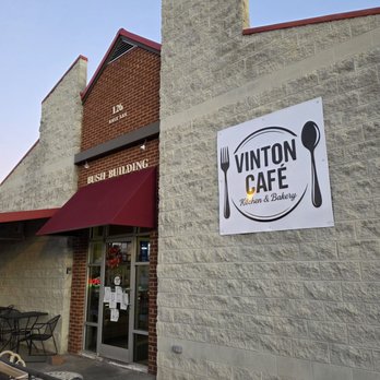 Vinton Cafe - The building front with their name and logo up front and an area for outdoor dining when the weather is nice. - Breakfast & Brunch Near Me - Vinton, Virginia