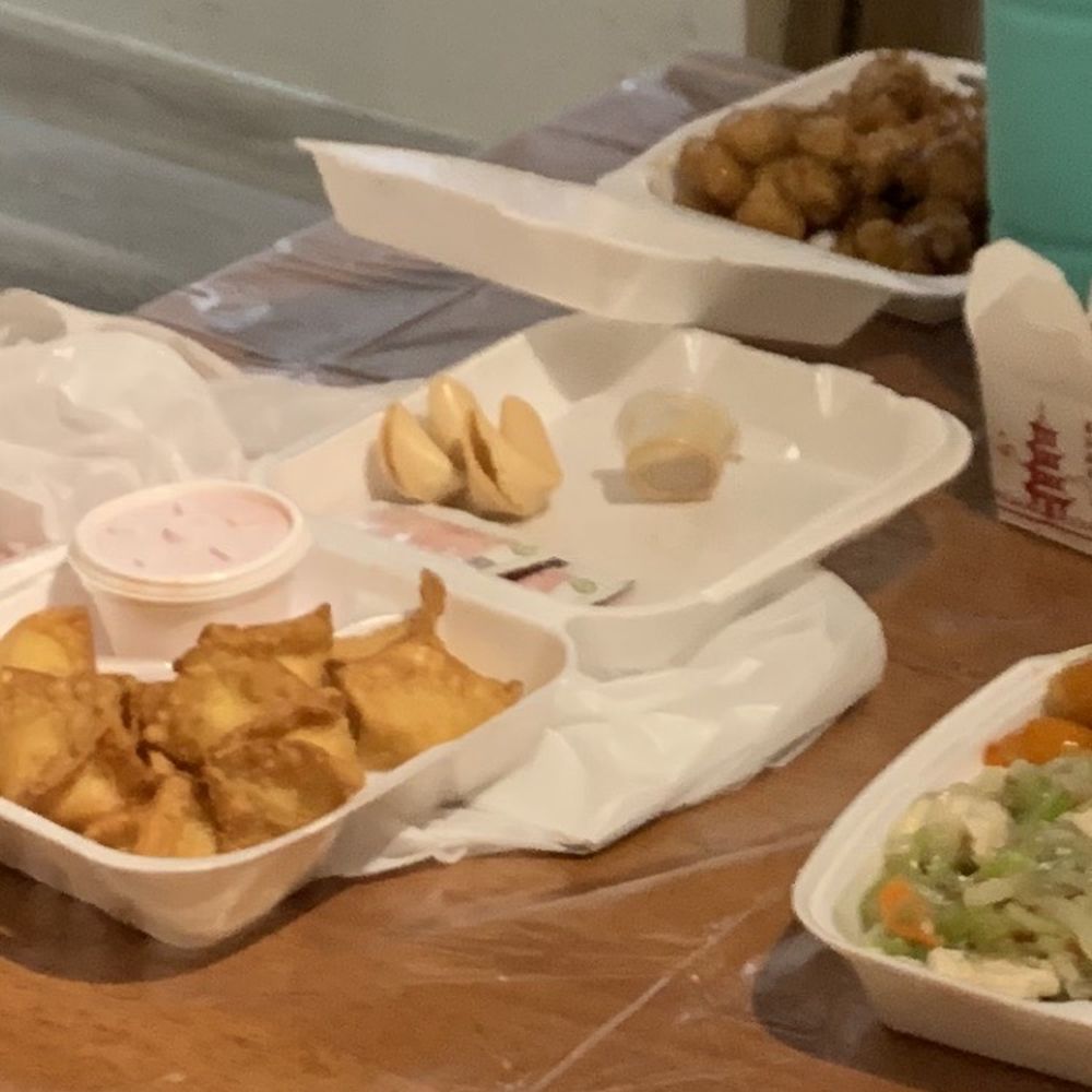 Crab cream cheese wontons front left, sesame chicken in back, #9 front right.