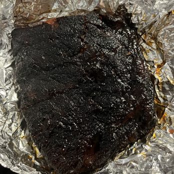 Hog Wild Pit Bar-B-Q - Sauce on the ribs after I asked for it on the side. Ribs so burnt and tough that I couldn't chew through it. - Barbeque Near Me - Derby, Kansas Hog Wild Pit Bar-B-Q - Sauce on the ribs after I asked for it on the side. Ribs so burnt and tough that I couldn't chew through it. - Barbeque Near Me - Derby, Kansas