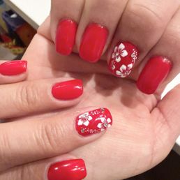 Gel builder nails with Hawaiian flowers.