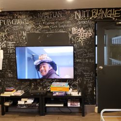 College Backpackers Hostel - Seating/Lounge TV area. Man sitting in here told on me for taking pictures as he was watching TV blasted at max volume.