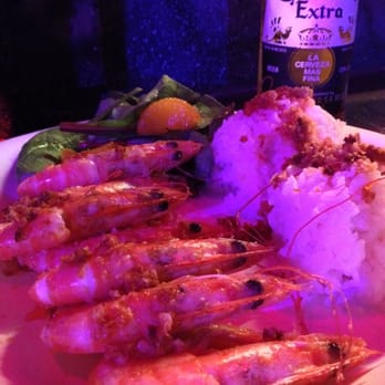 Cuckoo Coconuts Waikiki - Garlic shrimp and a cold beer! Ono! - Cocktail Bars Near Me - Honolulu, Hawaii