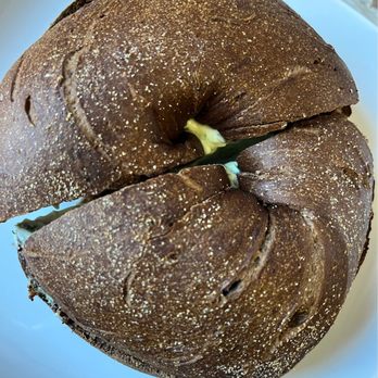 Rego Bagels - pumpernickel bagel toasted with garlic & herb spread - Bagels Near Me - Rego Park, New York Rego Bagels - pumpernickel bagel toasted with garlic & herb spread - Bagels Near Me - Rego Park, New York