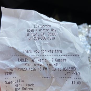 Los Gordos - a person holding a receipt - Mexican Near Me - Winton, California
