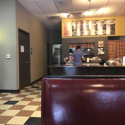 a restaurant with a checkered floor a restaurant with a checkered floor