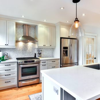 A-Top Remodeling - a kitchen with a center island - Cabinetry Near Me - Downers Grove, Illinois