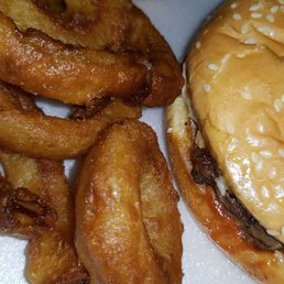 Cheeseburger (meat & cheese only) with onion rings.