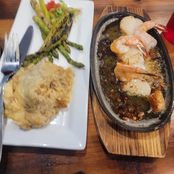 Neptune's Seafood Pub - Broiled shrimp and scallop combo with mash potatoes and asparagus. - Seafood Near Me - North Beach, Maryland Neptune's Seafood Pub - Broiled shrimp and scallop combo with mash potatoes and asparagus. - Seafood Near Me - North Beach, Maryland