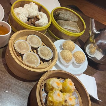 Ty Ginger Asian Bistro - Top to bottom, left to right: cha sui bao, law mei gai, xiao long bao, sesame balls, sui mai - Asian Fusion Near Me - Dublin, Ohio Ty Ginger Asian Bistro - Top to bottom, left to right: cha sui bao, law mei gai, xiao long bao, sesame balls, sui mai - Asian Fusion Near Me - Dublin, Ohio