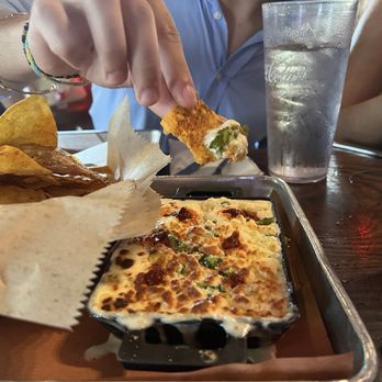 Home Team BBQ - Baked queso w those amazing chips. - Barbeque Near Me - Sullivan's Island, South Carolina