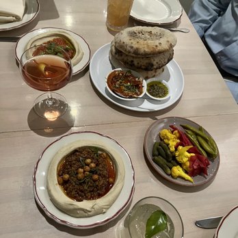Safta - Tunisian tomato hummus, lamb ragù hummus, pickles, pita and muhammara, plus drinks - Middle Eastern Near Me - Denver, Colorado Safta - Tunisian tomato hummus, lamb ragù hummus, pickles, pita and muhammara, plus drinks - Middle Eastern Near Me - Denver, Colorado