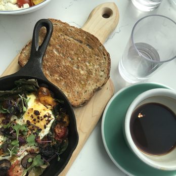 Bluestone Lane West End Café - Green baked eggs with toast and a large long black. - Coffee & Tea Near Me - Washington, DC, District of Columbia Bluestone Lane West End Café - Green baked eggs with toast and a large long black. - Coffee & Tea Near Me - Washington, DC, District of Columbia