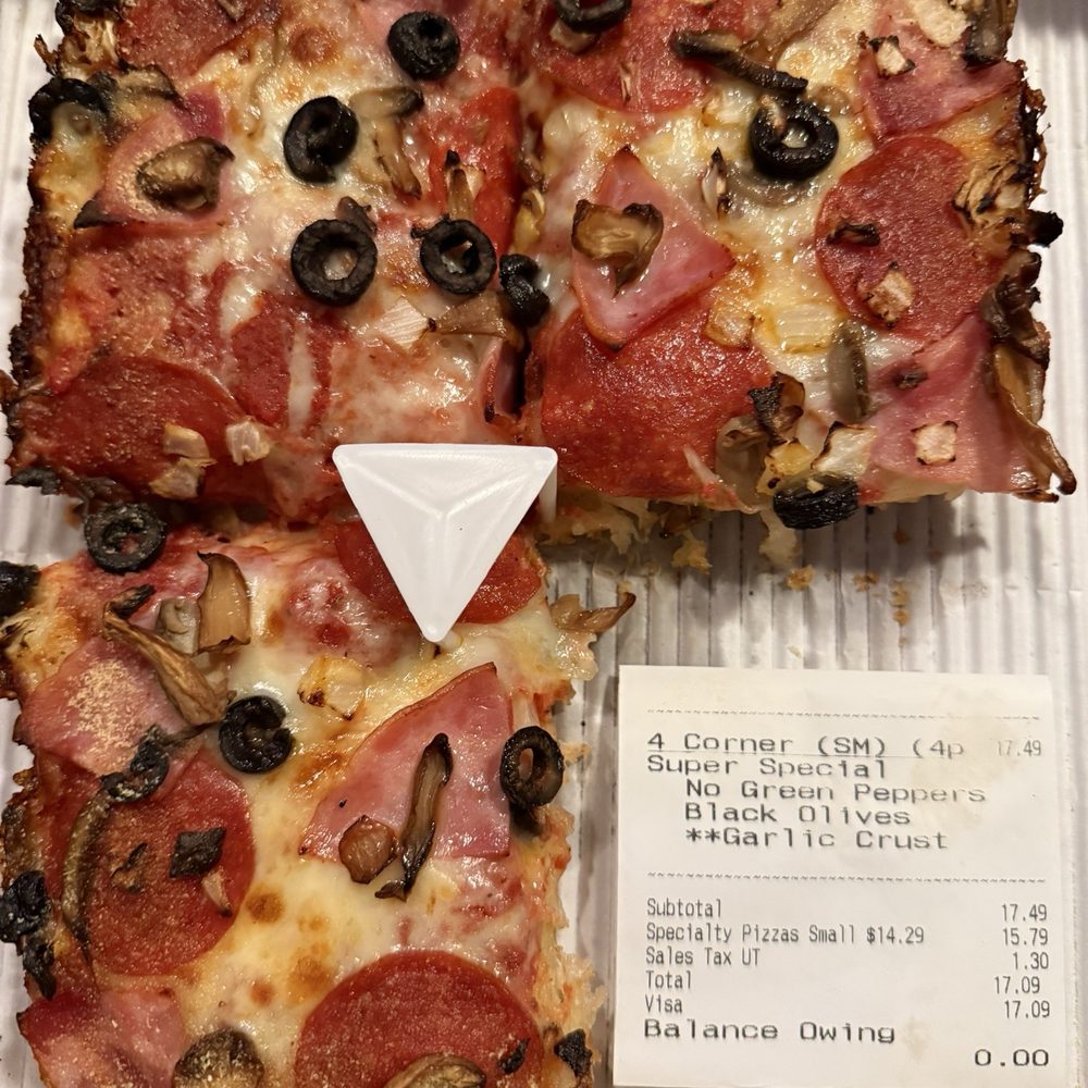 4 Corner Super Special. No green peppers added black olives. Garlic crust