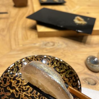 Itosugi Kappo Cuisine - a sushi on a plate with chopsticks - Japanese Near Me - Vancouver, British Columbia Itosugi Kappo Cuisine - a sushi on a plate with chopsticks - Japanese Near Me - Vancouver, British Columbia