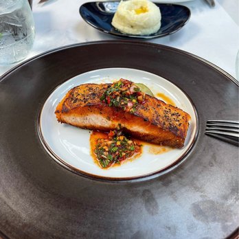 Owen's Bistro - Pan roasted salmon: RECOMMEND! I loveeee the gochujang chimichurri sauce. The sauce by default isn't spicy at all--just a kick. - New American Near Me - Chino, California Owen's Bistro - Pan roasted salmon: RECOMMEND! I loveeee the gochujang chimichurri sauce. The sauce by default isn't spicy at all--just a kick. - New American Near Me - Chino, California